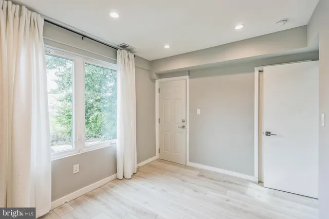 a view of entryway with wooden floor