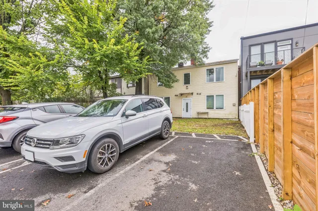 a view of a car parked in front of a house