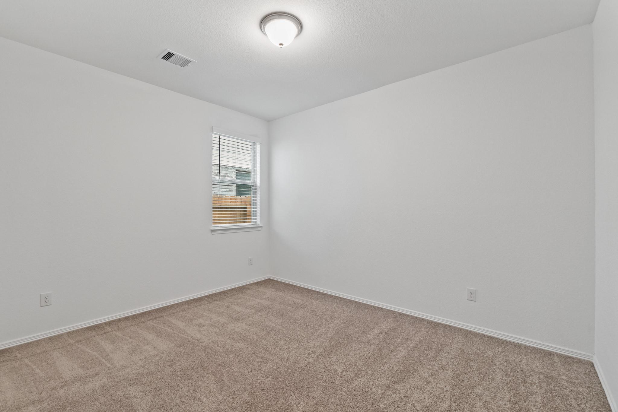 23018 Forebear Drive Katy, TX 77493 - Photo 20 of 25 an empty room with a window
