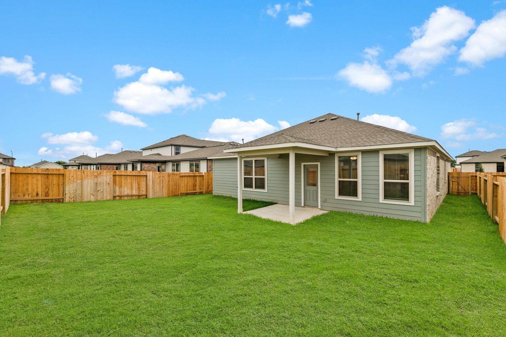 23018 Forebear Drive Katy, TX 77493 - Photo 23 of 25 a view of a house with a yard and sitting area
