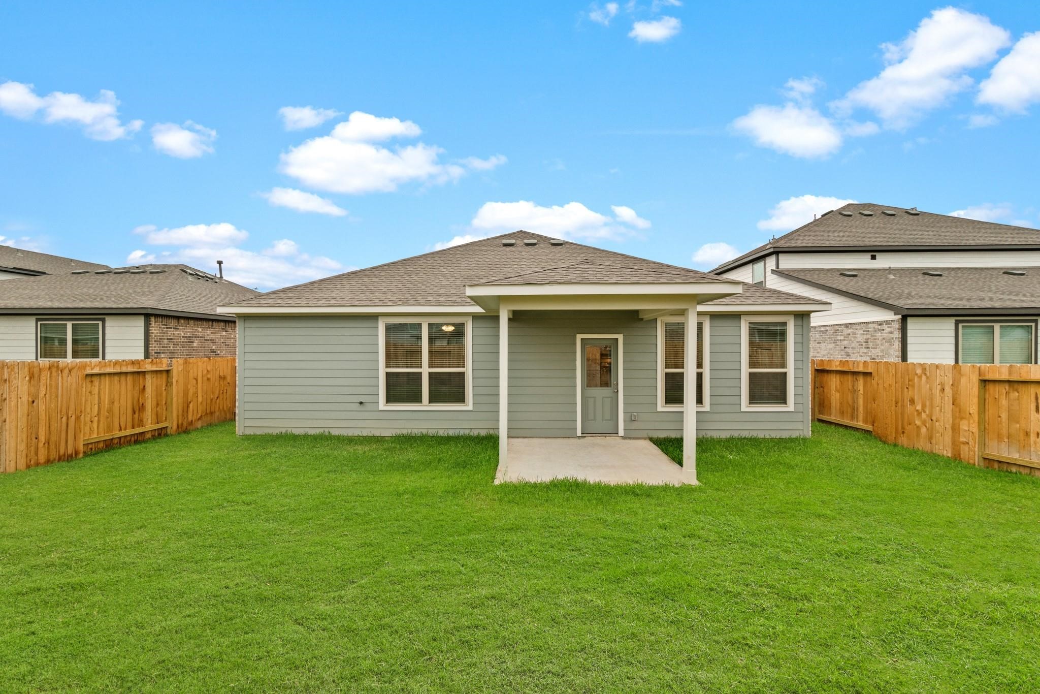 23018 Forebear Drive Katy, TX 77493 - Photo 24 of 25 a front view of a house with a garden