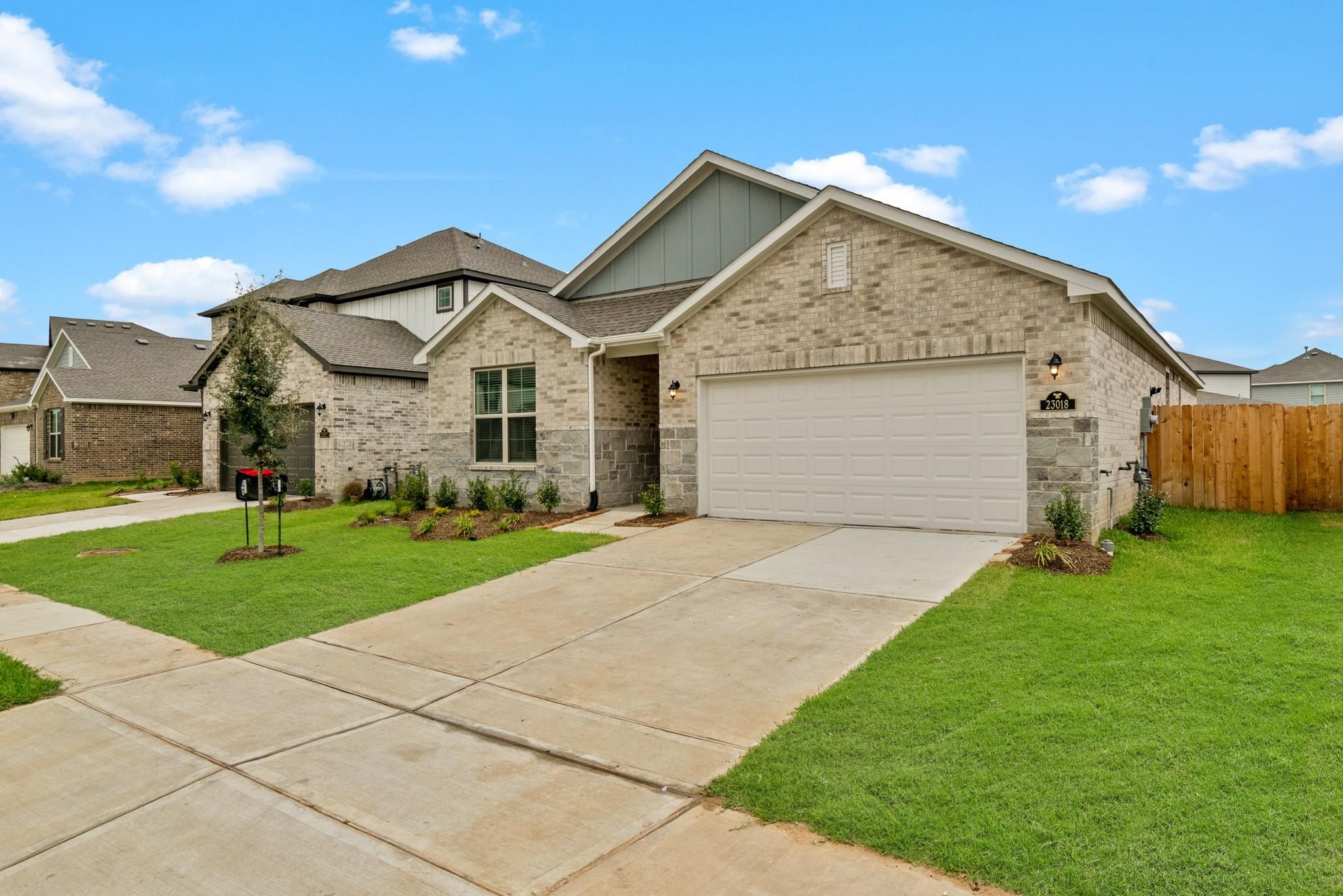 23018 Forebear Drive Katy, TX 77493 - Photo 25 of 25 a front view of house with yard and green space