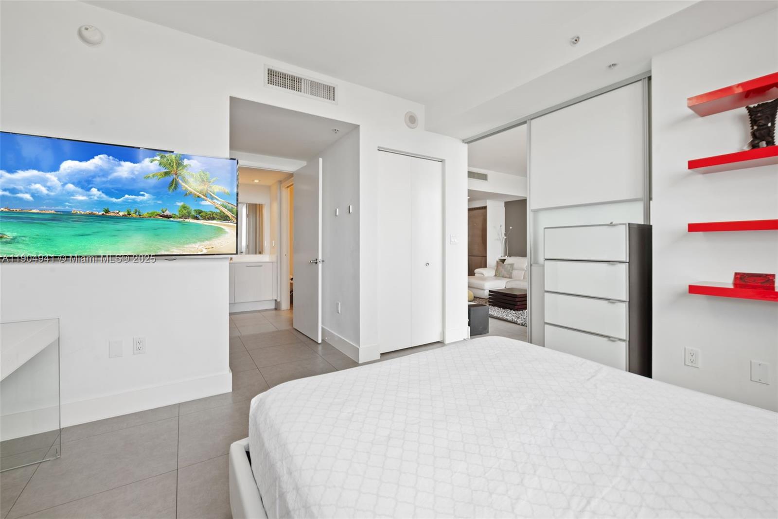 92 Southwest 3rd Street, Unit 3809 Miami, FL 33130 - Photo 12 of 32 a bedroom with a bed and a cabinets