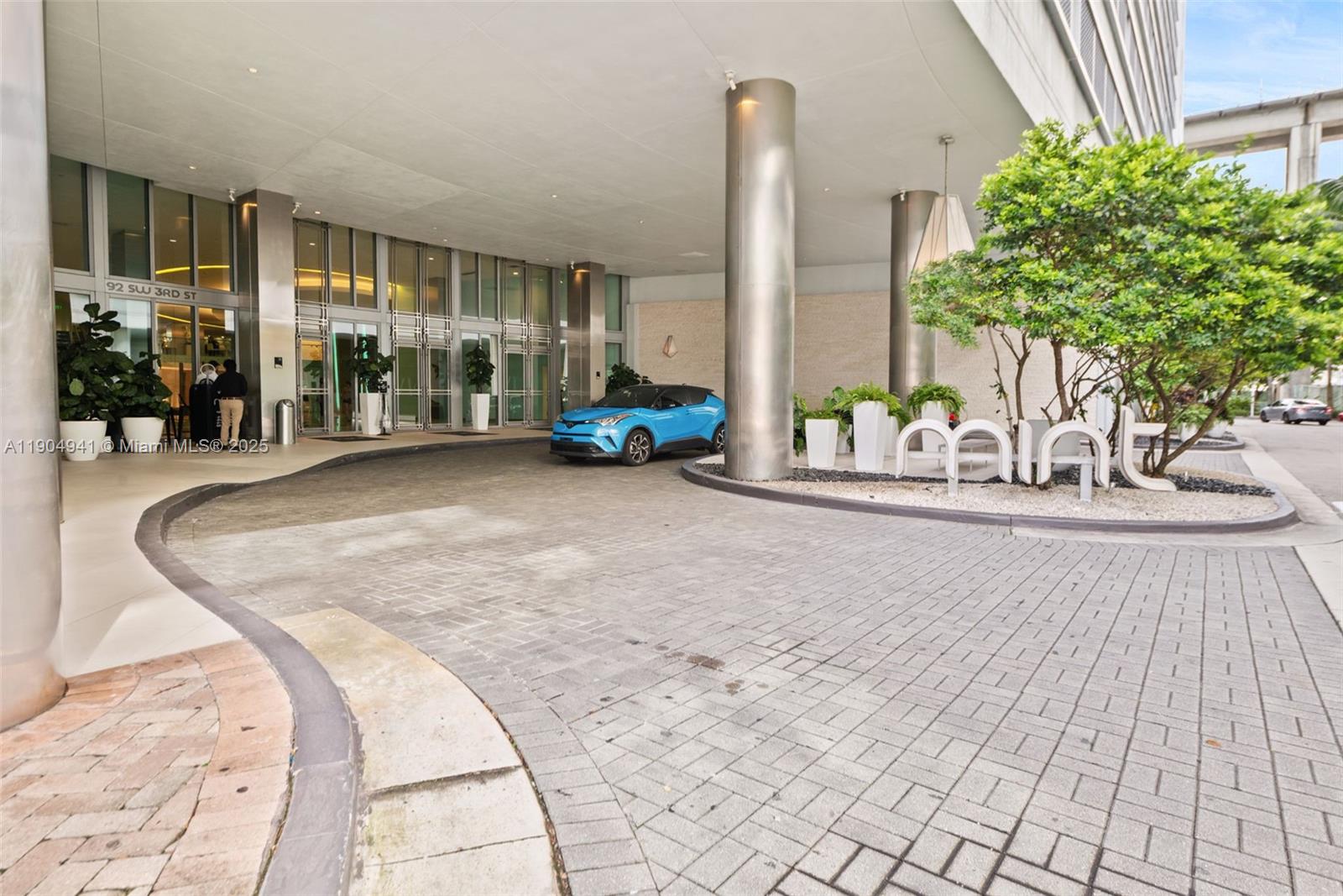 92 Southwest 3rd Street, Unit 3809 Miami, FL 33130 - Photo 25 of 32 a view of a room with floor to ceiling window and potted plants