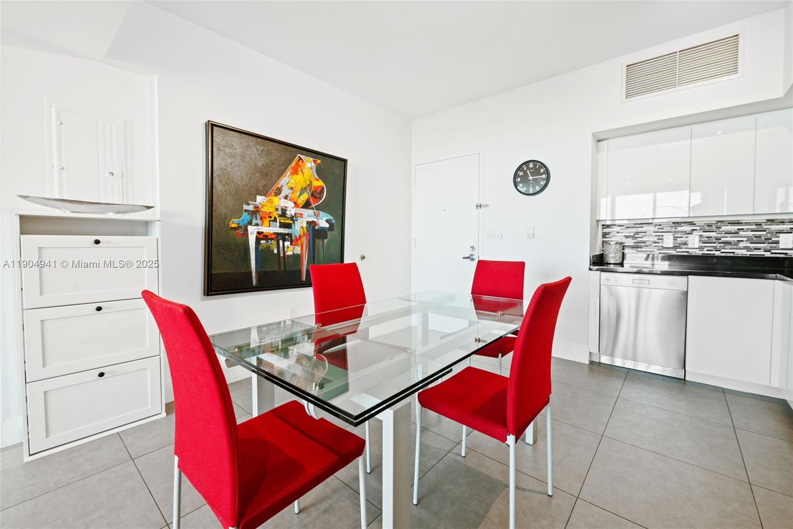 92 Southwest 3rd Street, Unit 3809 Miami, FL 33130 - Photo 4 of 32 a living room with furniture and a red chair