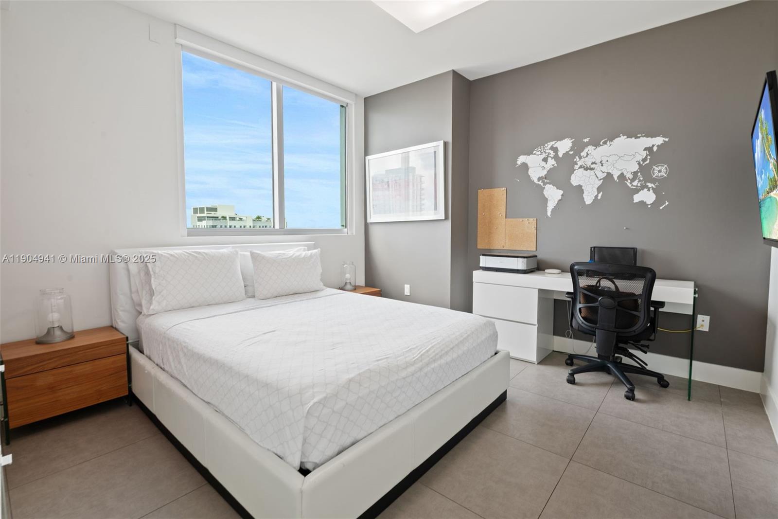 92 Southwest 3rd Street, Unit 3809 Miami, FL 33130 - Photo 10 of 32 a bedroom with a bed table chair and a window