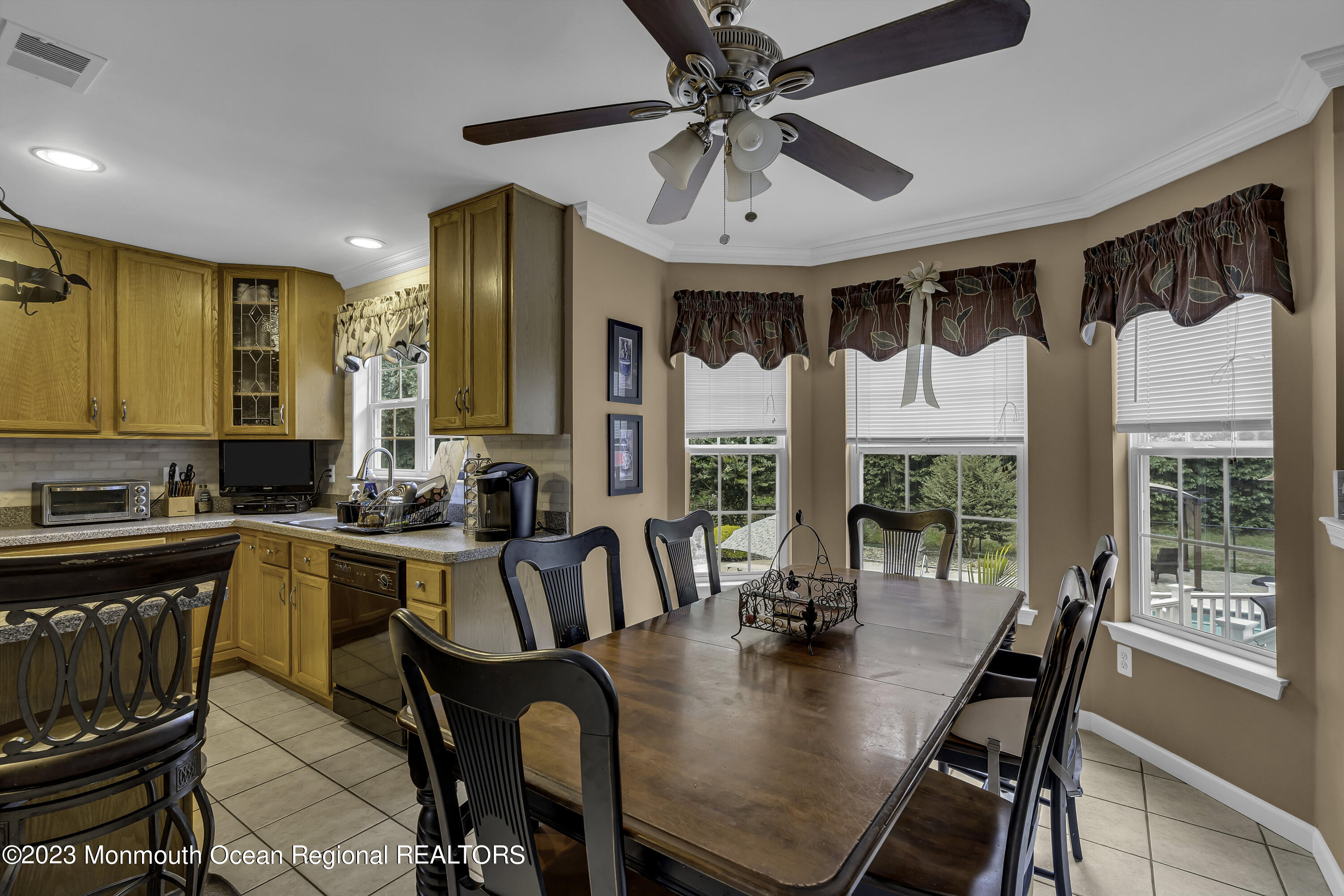 229 Lanes Mill Road Howell, NJ 07731 - Photo 13 of 58 a view of a dining room with furniture window and outside view