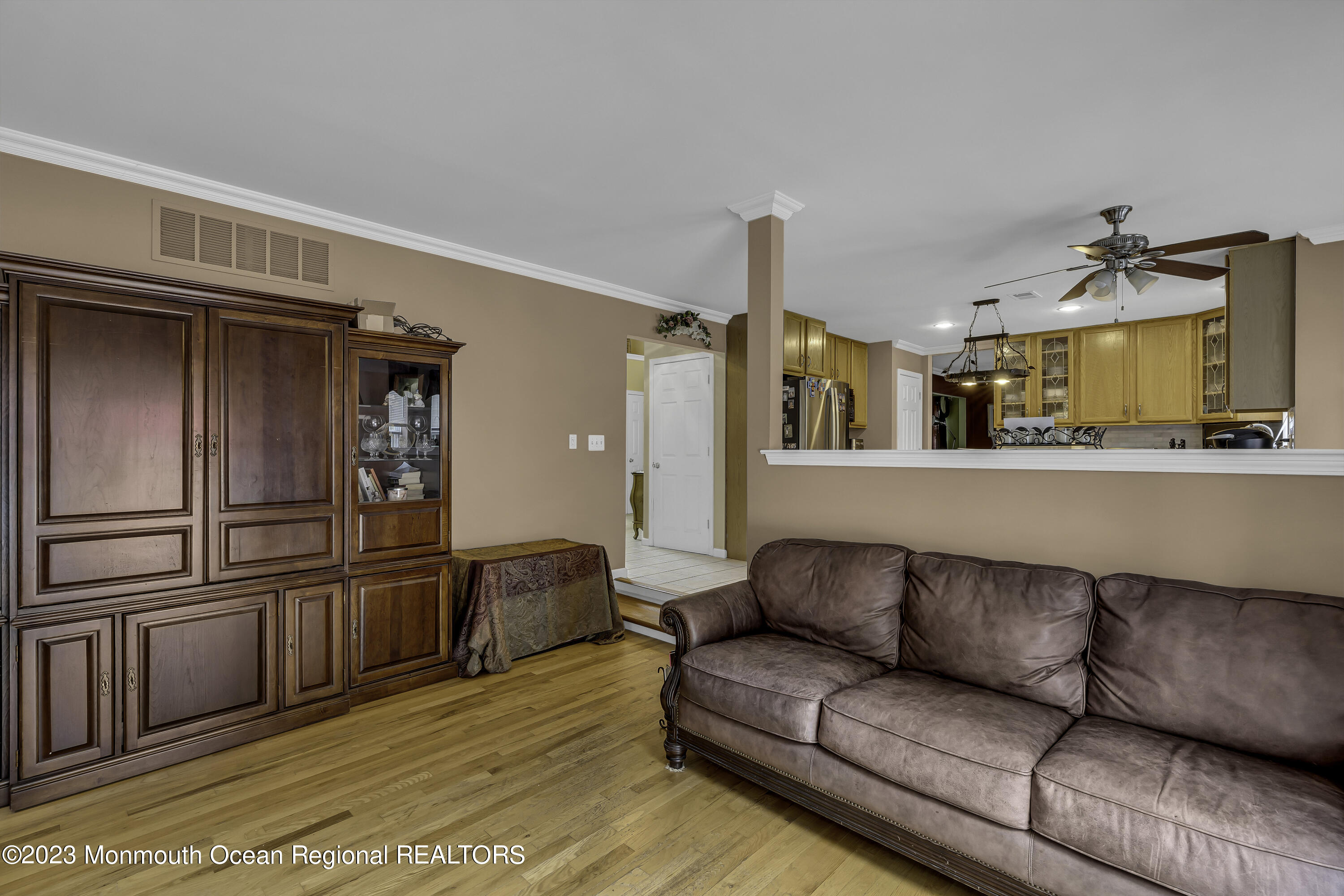 229 Lanes Mill Road Howell, NJ 07731 - Photo 16 of 58 a living room with stainless steel appliances kitchen island granite countertop furniture and a refrigerator
