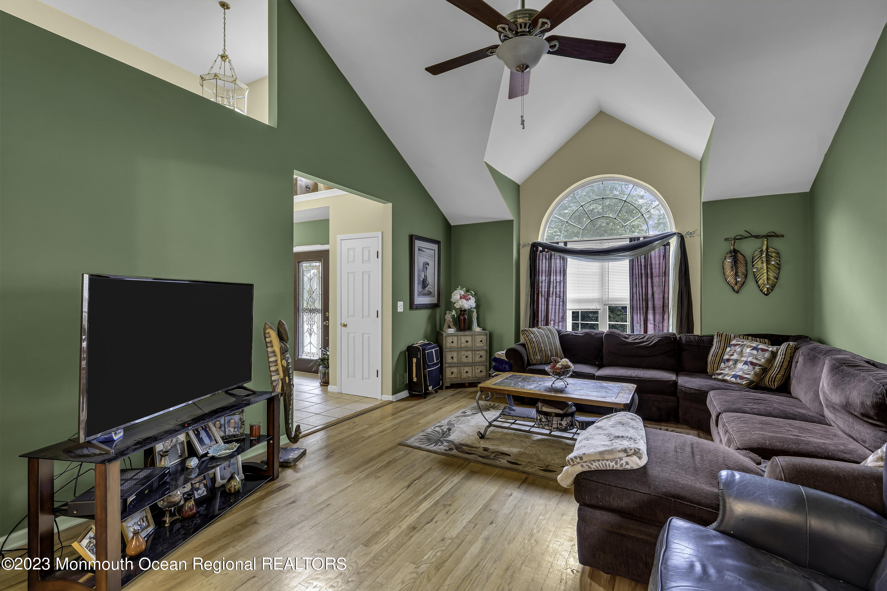 229 Lanes Mill Road Howell, NJ 07731 - Photo 23 of 58 a living room with furniture and a flat screen tv