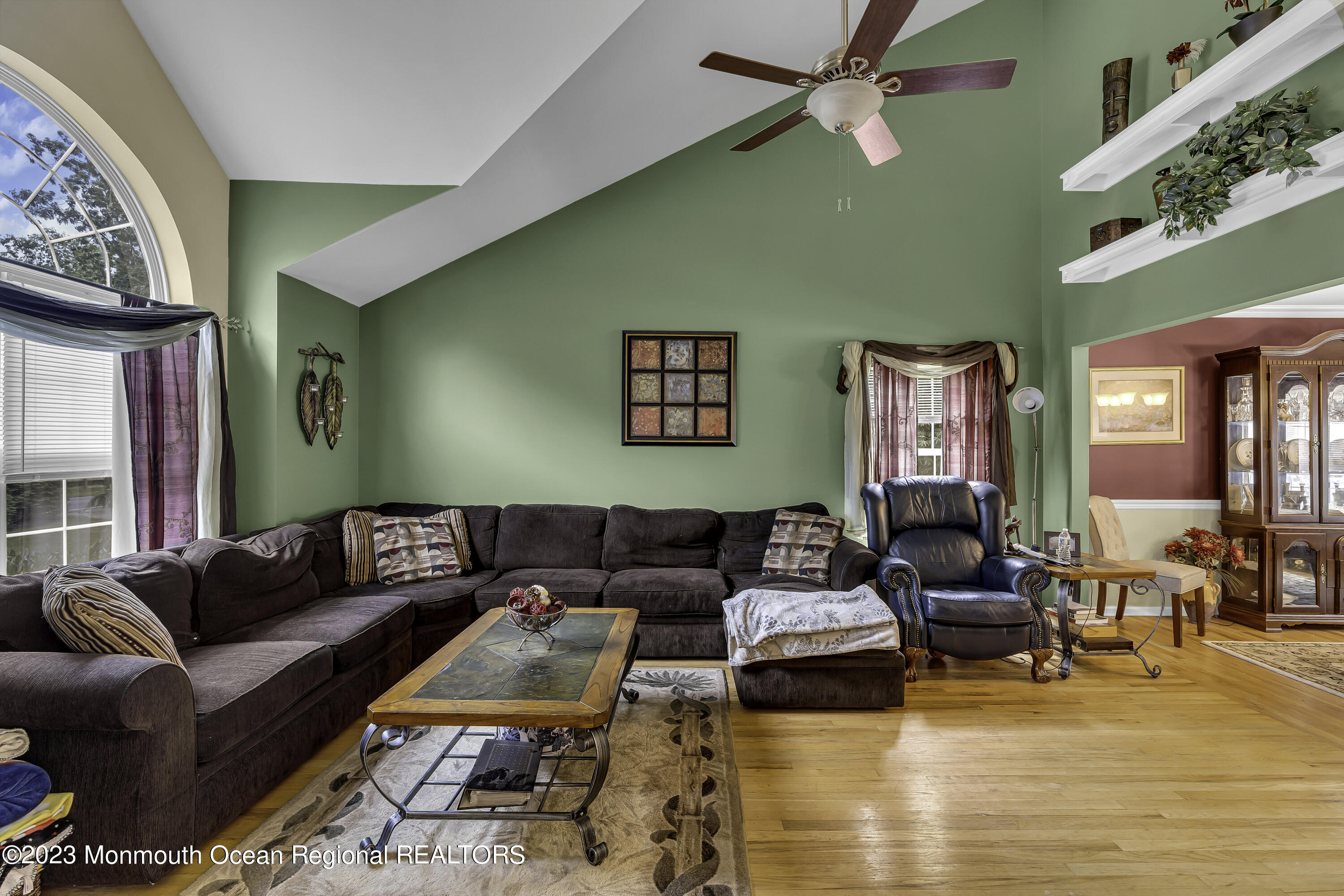 229 Lanes Mill Road Howell, NJ 07731 - Photo 25 of 58 a living room with furniture wooden floor and a large window