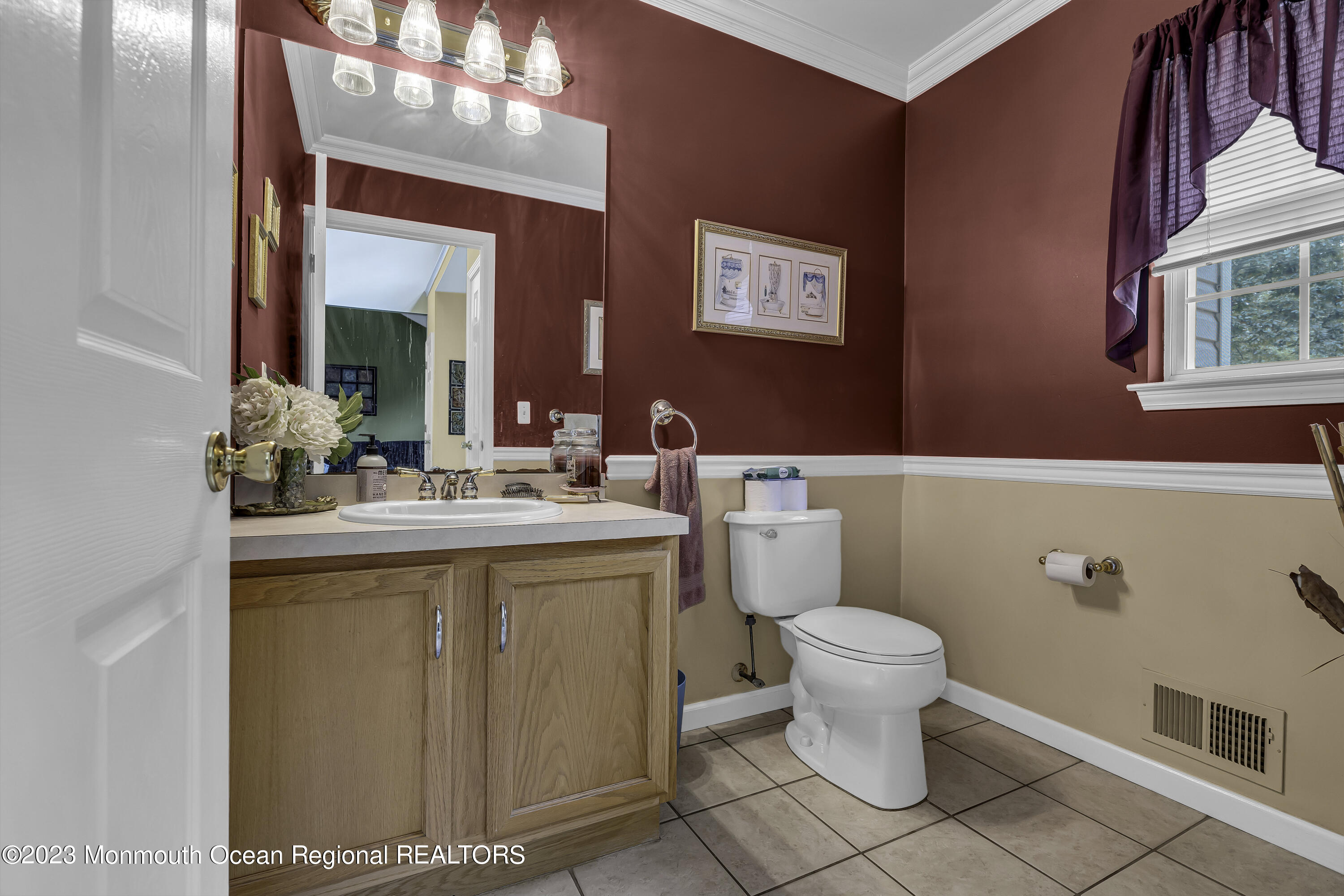 229 Lanes Mill Road Howell, NJ 07731 - Photo 26 of 58 a bathroom with a sink a toilet and mirror