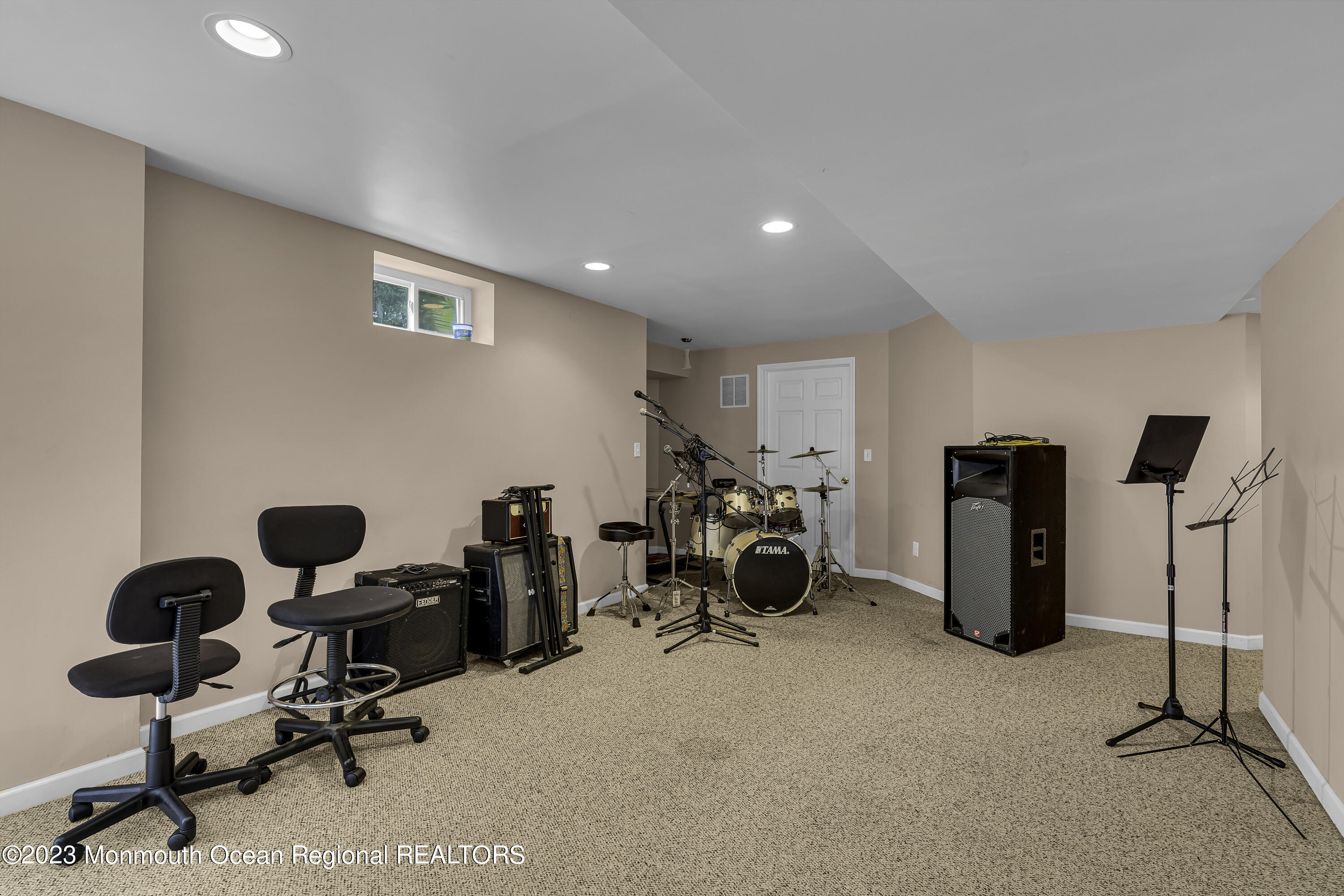 229 Lanes Mill Road Howell, NJ 07731 - Photo 28 of 58 a view of a workspace with furniture and gym equipment