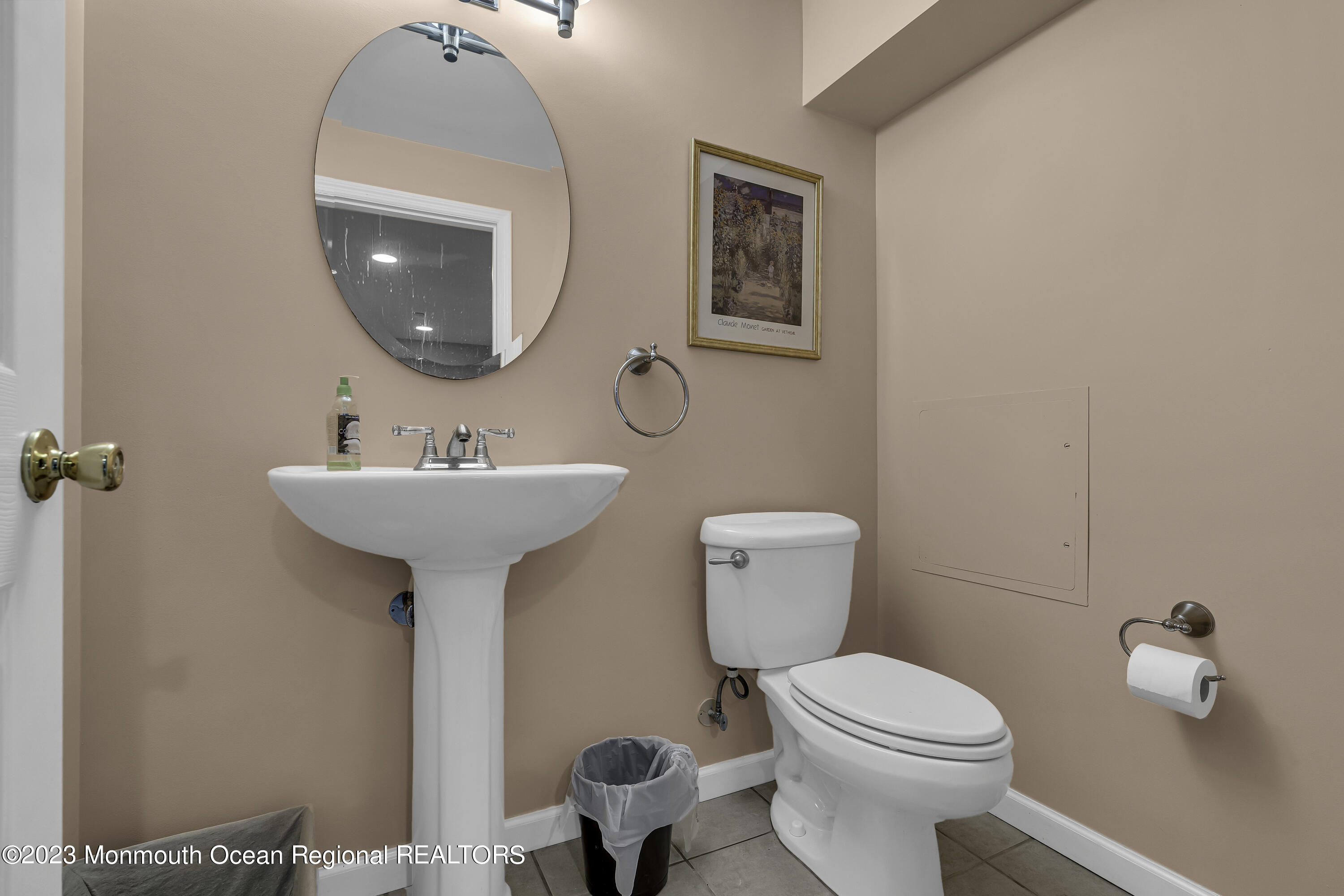 229 Lanes Mill Road Howell, NJ 07731 - Photo 32 of 58 a bathroom with a toilet sink and mirror