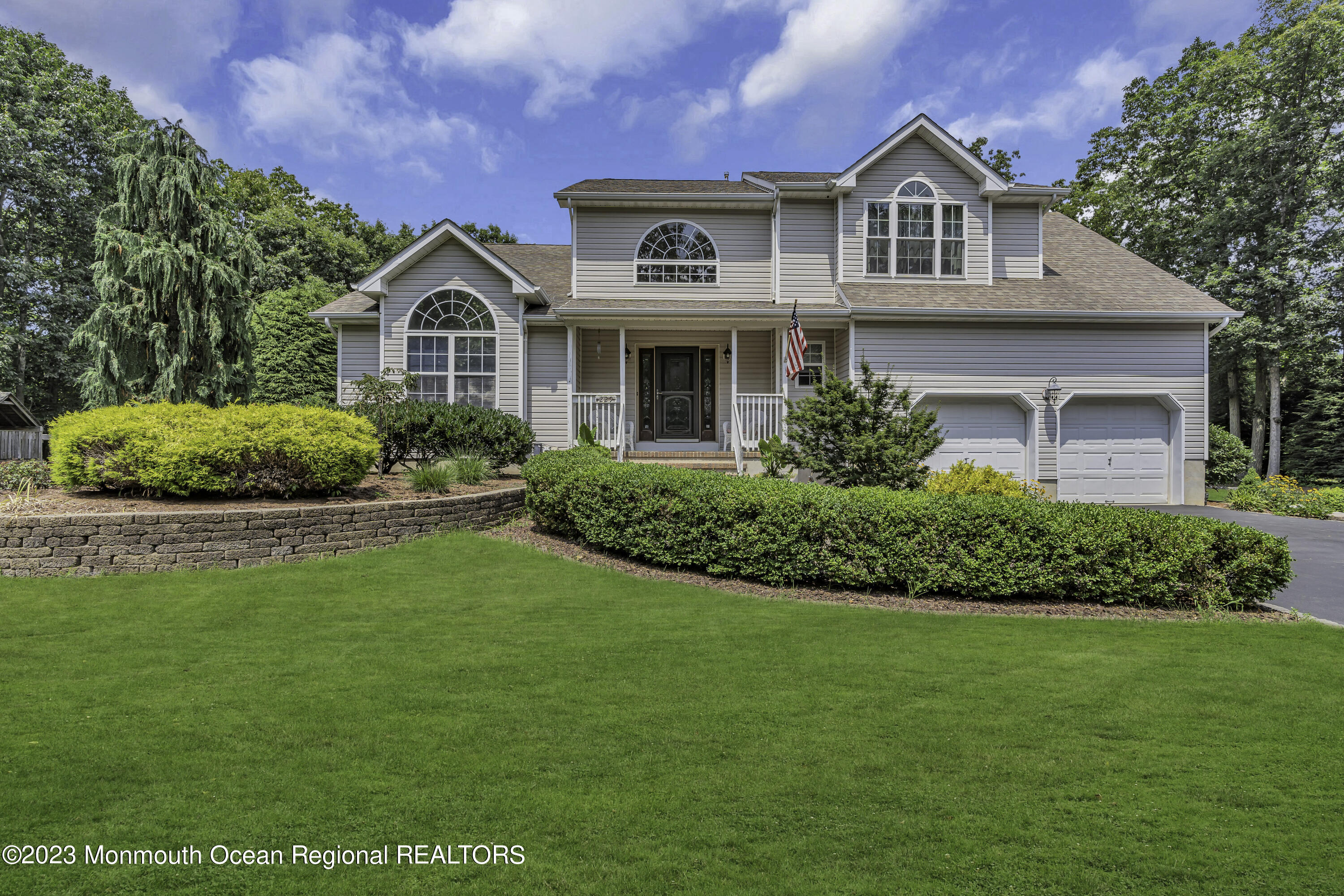 229 Lanes Mill Road Howell, NJ 07731 - Photo 4 of 58 a front view of a house with a yard