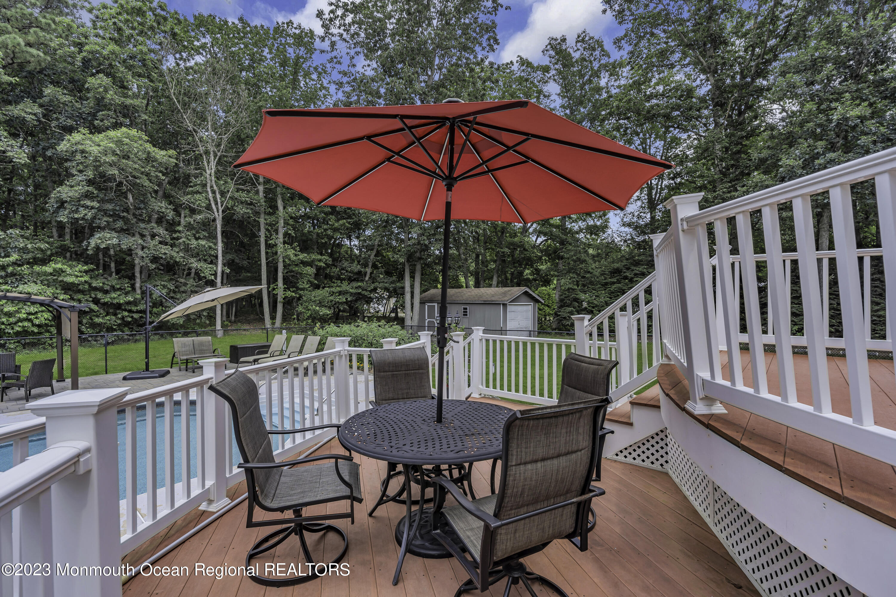 229 Lanes Mill Road Howell, NJ 07731 - Photo 43 of 58 a view of balcony with wooden floor and outdoor seating