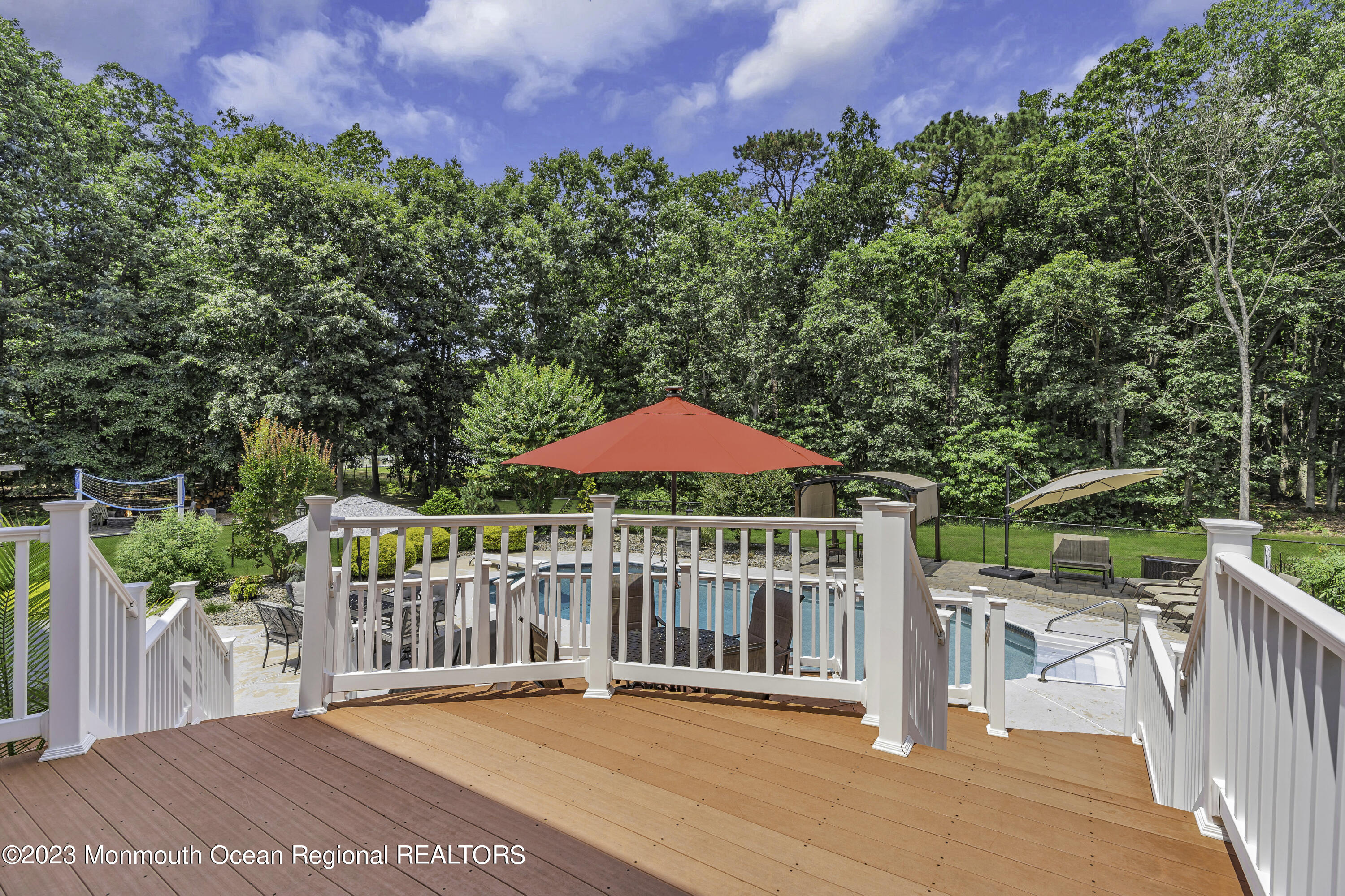 229 Lanes Mill Road Howell, NJ 07731 - Photo 45 of 58 a view of a wooden deck and a yard