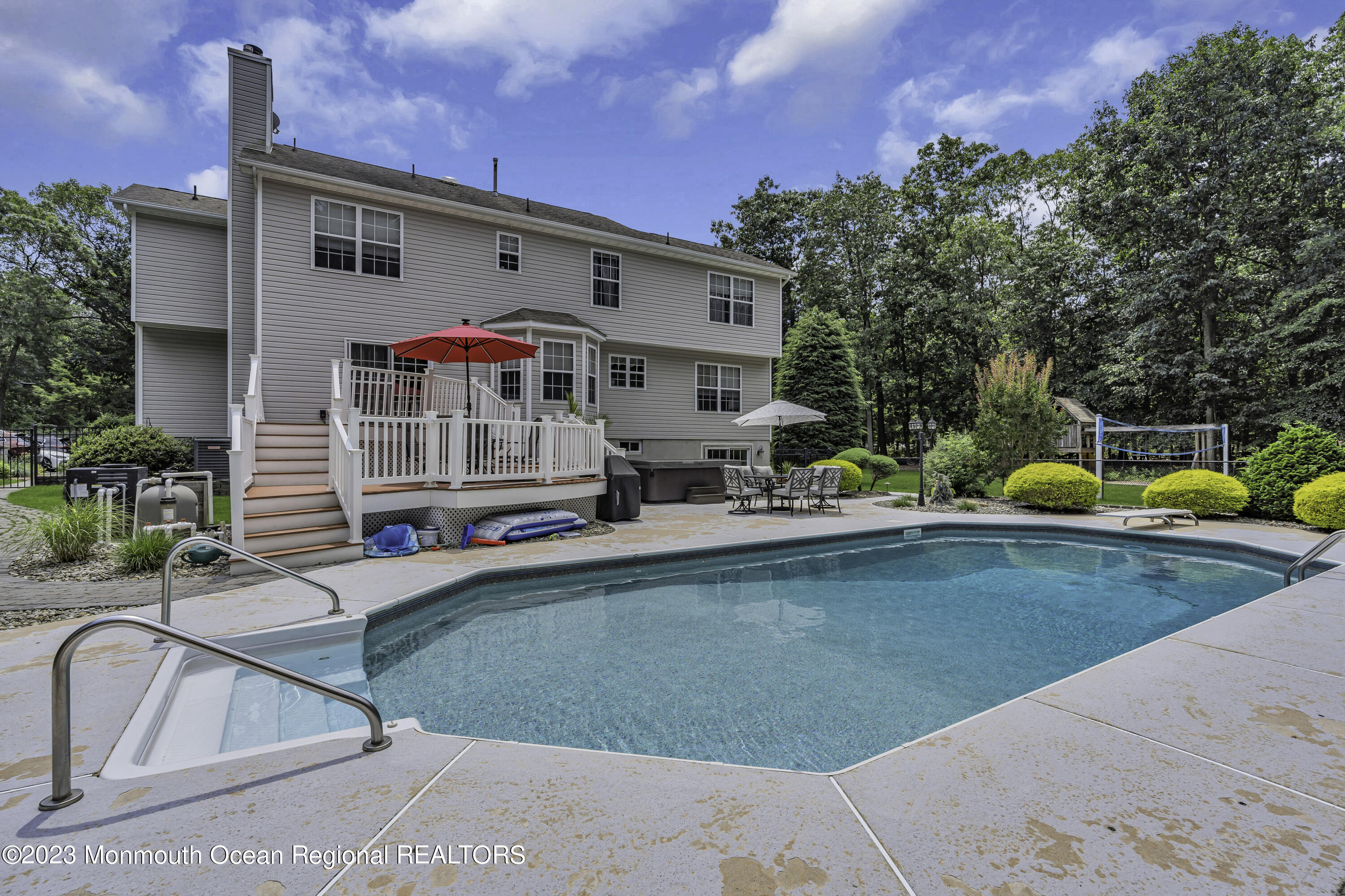 229 Lanes Mill Road Howell, NJ 07731 - Photo 49 of 58 a view of a house with a yard patio and sitting area