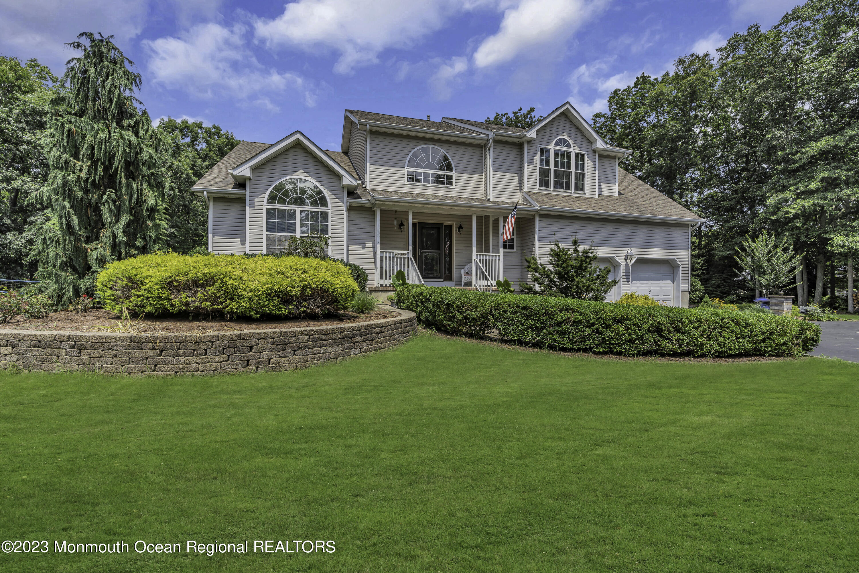 229 Lanes Mill Road Howell, NJ 07731 - Photo 5 of 58 a front view of a house with a yard