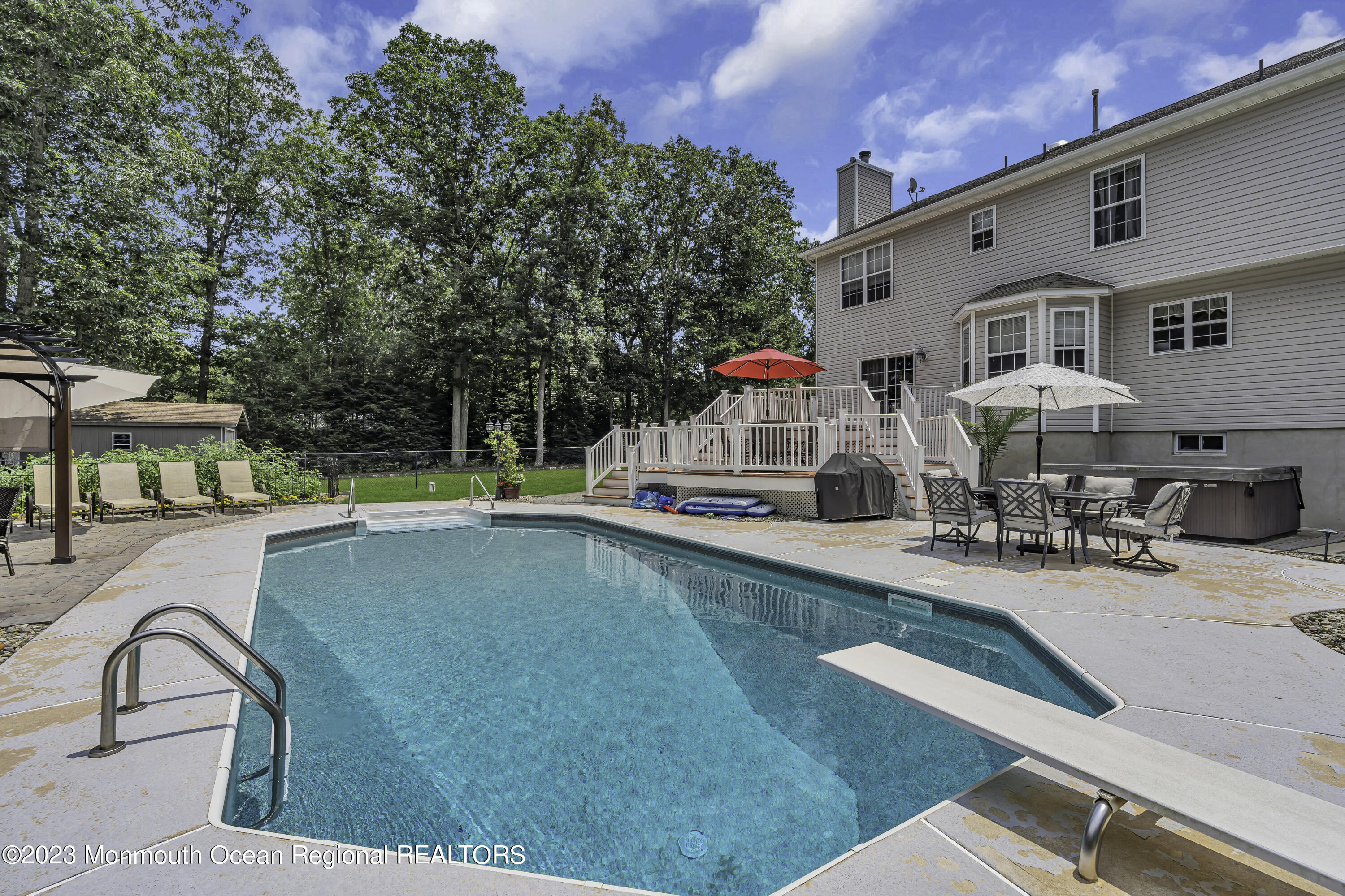 229 Lanes Mill Road Howell, NJ 07731 - Photo 51 of 58 a front view of house with yard and swimming pool