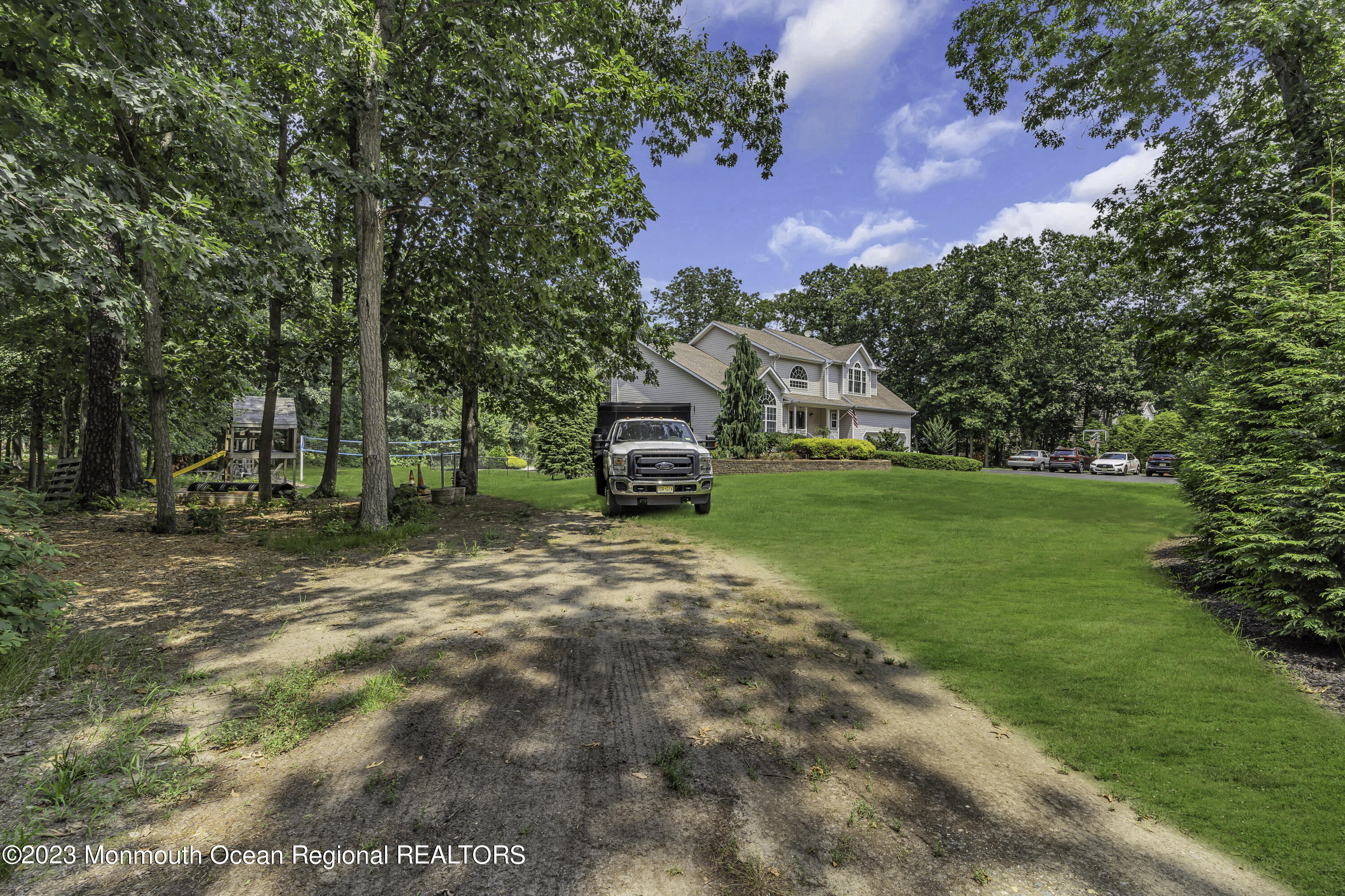 229 Lanes Mill Road Howell, NJ 07731 - Photo 55 of 58 a front view of a house with a yard
