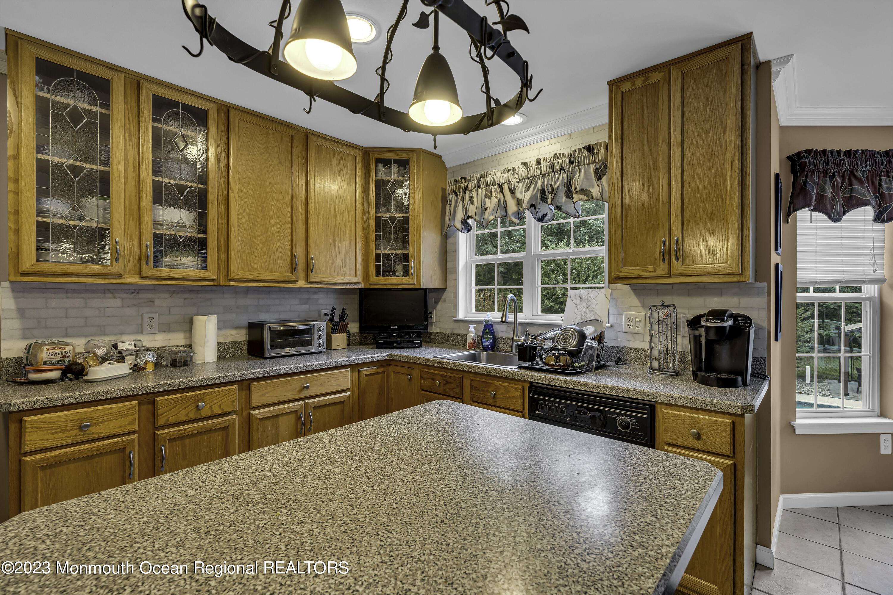 229 Lanes Mill Road Howell, NJ 07731 - Photo 10 of 58 a kitchen with sink cabinets and stove