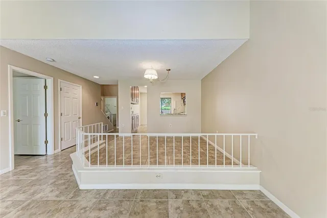 a view of a bedroom with wooden floor