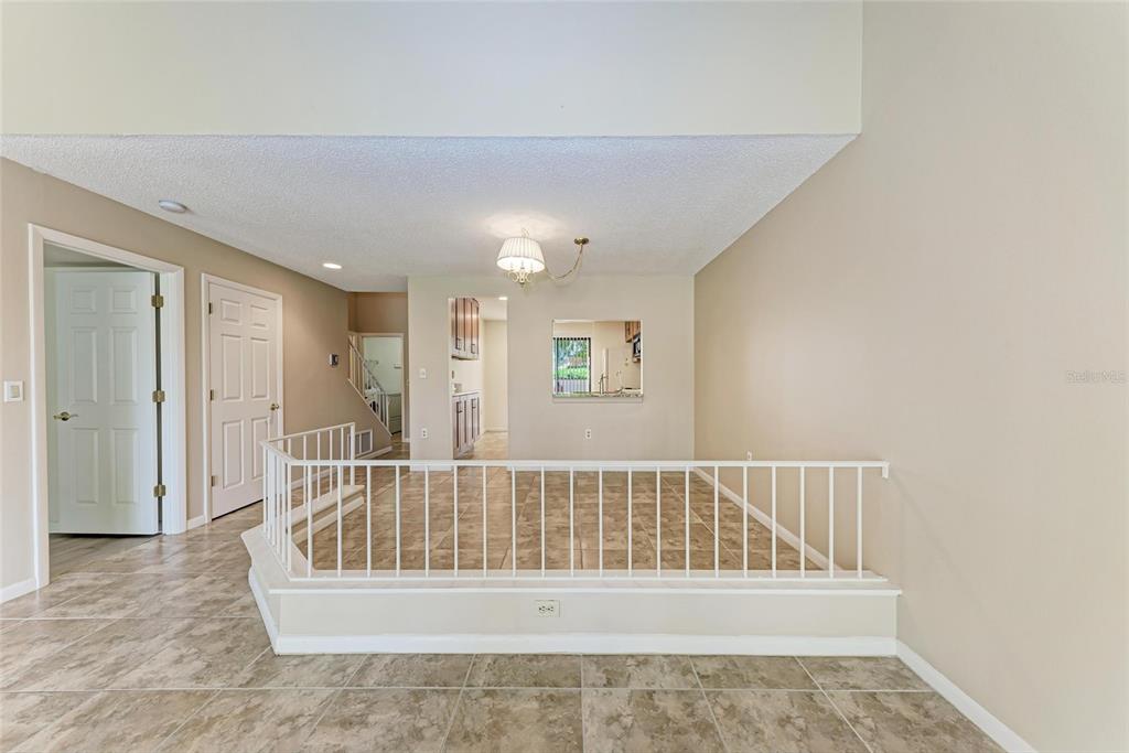 5362 Huntingwood Court, Unit 16 Sarasota, FL 34235 - Photo 17 of 46 a view of a bedroom with wooden floor