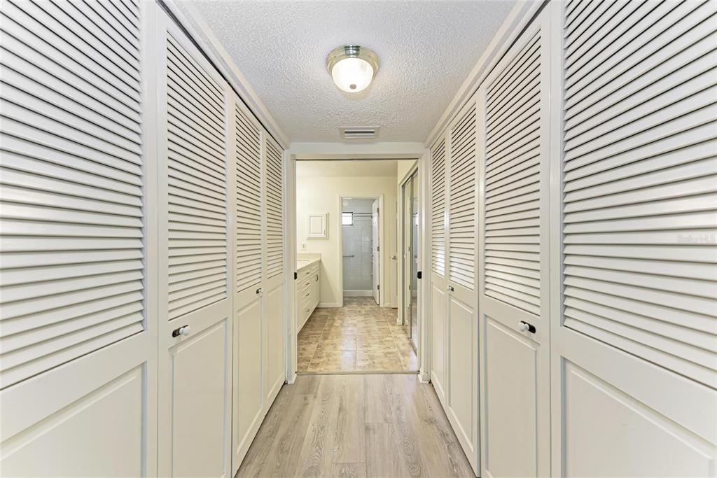 5362 Huntingwood Court, Unit 16 Sarasota, FL 34235 - Photo 24 of 46 a view of a bathroom with a hallway