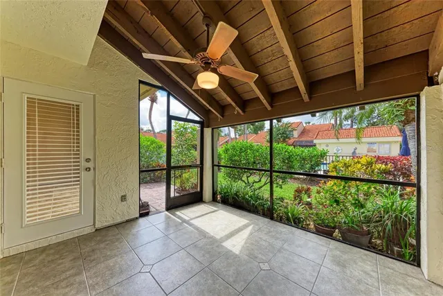 a view of a house with potted plants