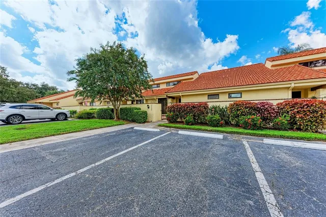 a front view of house with yard and swimming pool