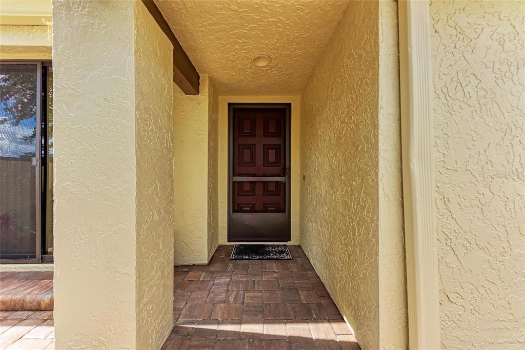 5362 Huntingwood Court, Unit 16 Sarasota, FL 34235 - Photo 6 of 46 a view of a door and wooden floor
