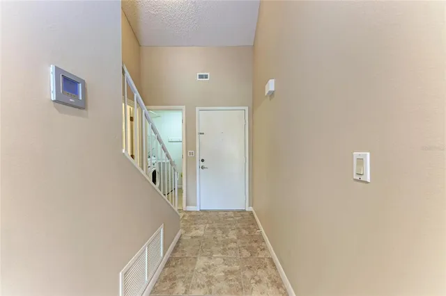 a view of a hallway view with staircase