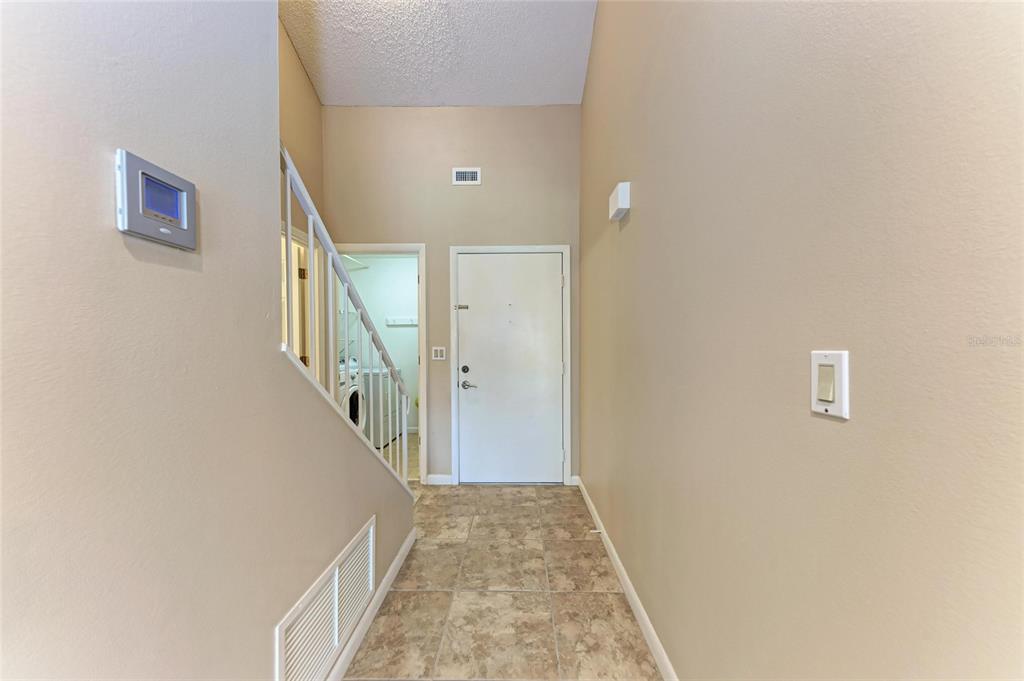 5362 Huntingwood Court, Unit 16 Sarasota, FL 34235 - Photo 7 of 46 a view of a hallway view with staircase