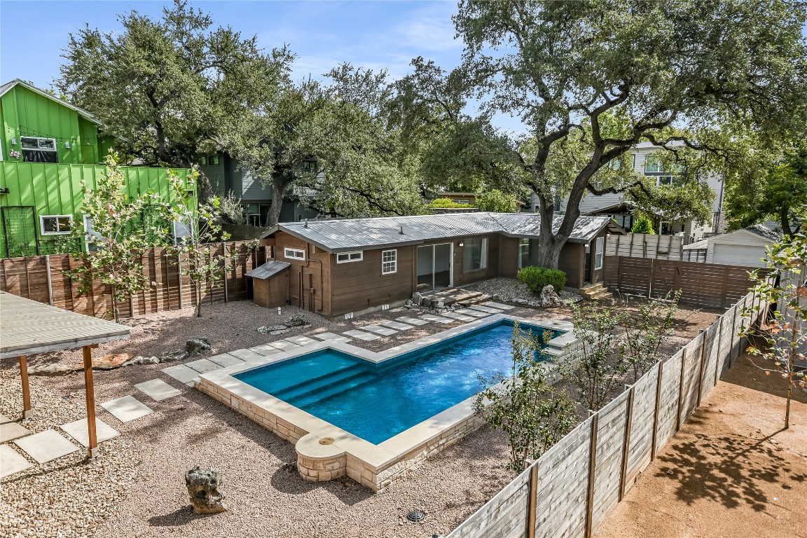 905 West Elizabeth Street Austin, TX 78704 - Photo 9 of 9 a view of house with backyard patio and outdoor seating