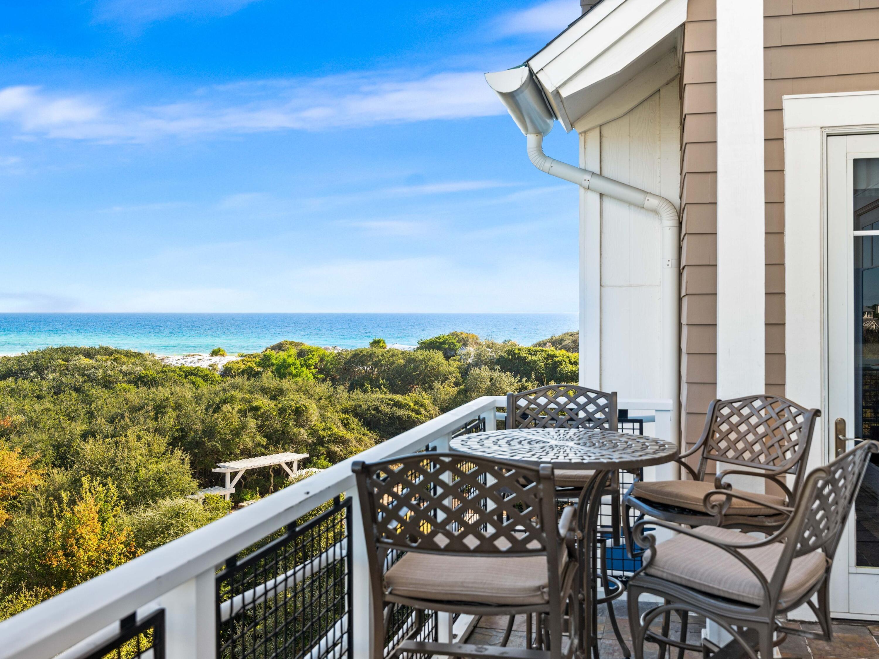 99 Compass Point Way, Unit 401 Watersound, FL 32461 - Photo 23 of 33 a view of a chairs and table on the balcony