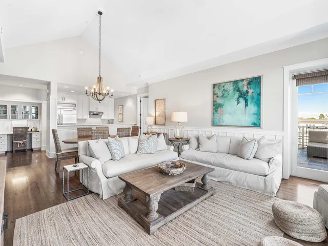 a living room with furniture or couch and a chandelier