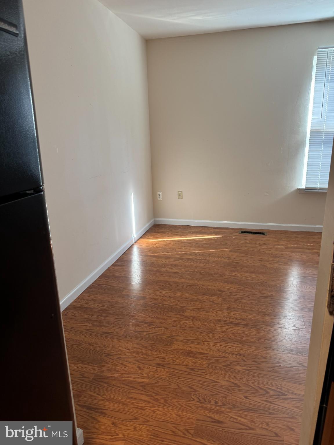 1823 Jaybird Court Severn, MD 21144 - Photo 13 of 21 a view of room with window and wooden floor