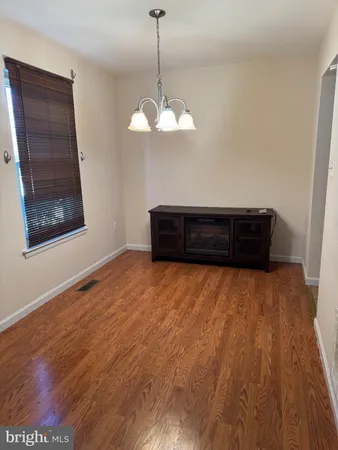 a bed room with a bed and a dresser