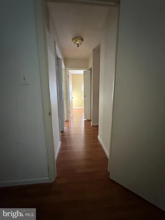 a bathroom with a granite countertop sink toilet a mirror and shower
