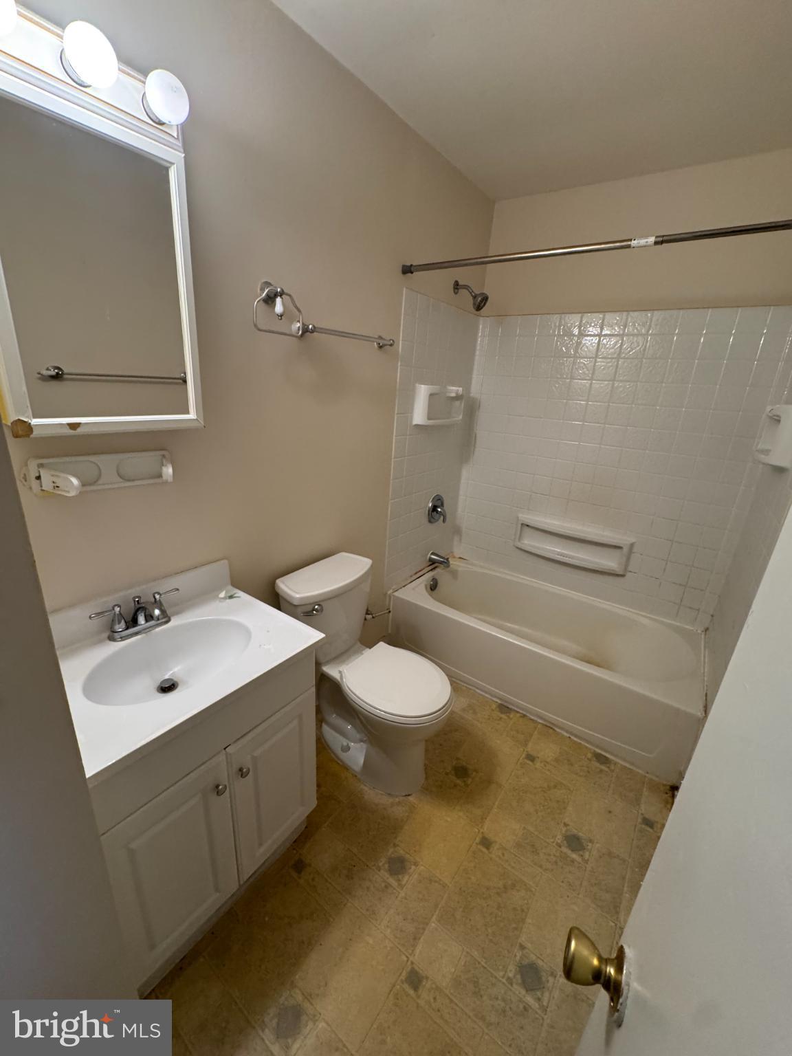 1823 Jaybird Court Severn, MD 21144 - Photo 5 of 21 a bathroom with a granite countertop sink toilet a mirror and shower
