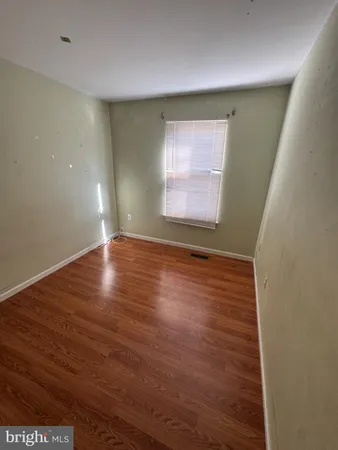 a view of staircase with wooden floor and stairs