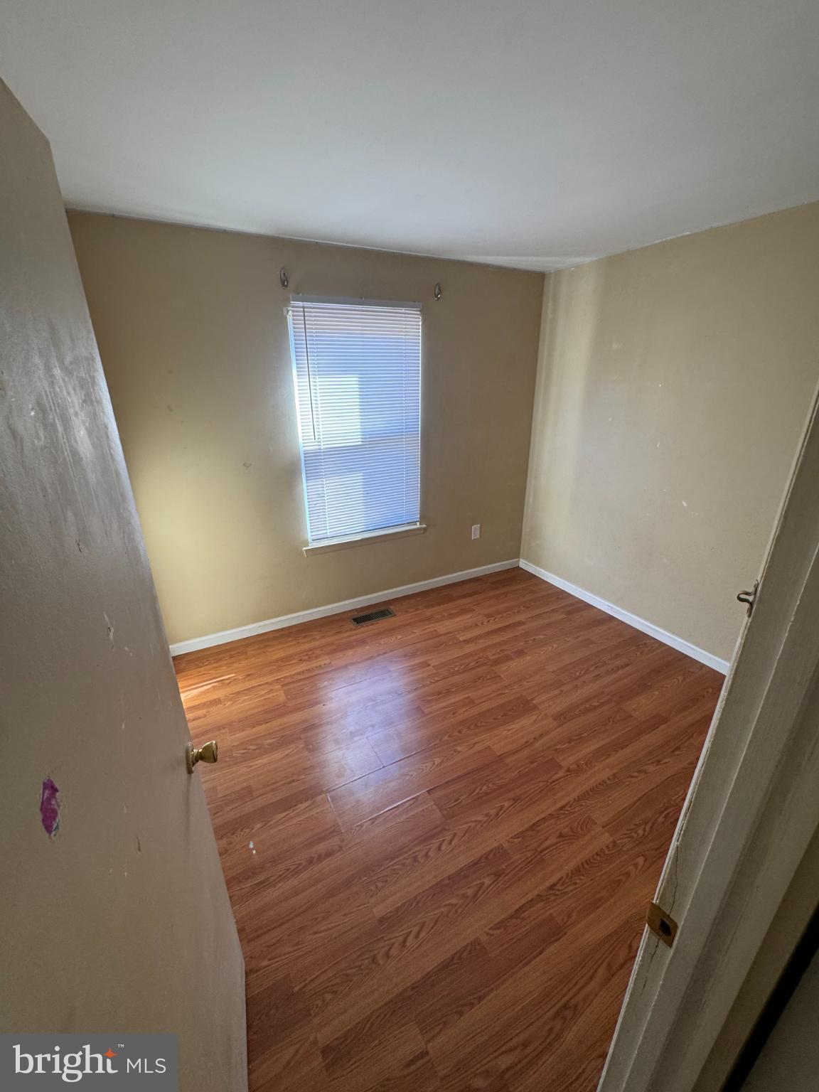 1823 Jaybird Court Severn, MD 21144 - Photo 10 of 21 an empty room with wooden floor and windows