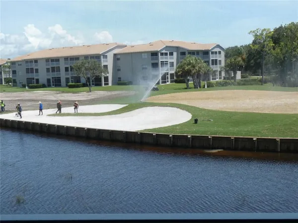 a view of yard with swimming pool and outdoor seating