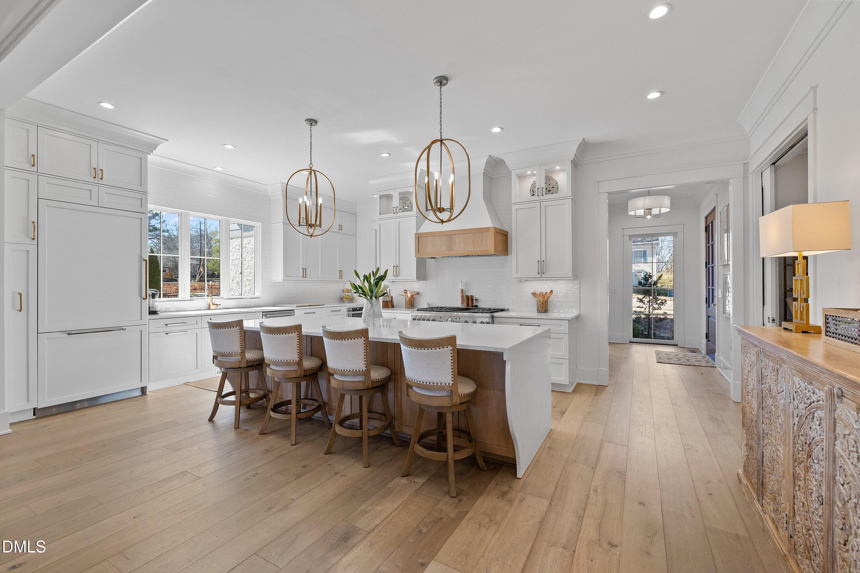 906 Brooks Avenue Raleigh, NC 27607 - Photo 14 of 64 a large kitchen with a table and chairs in it