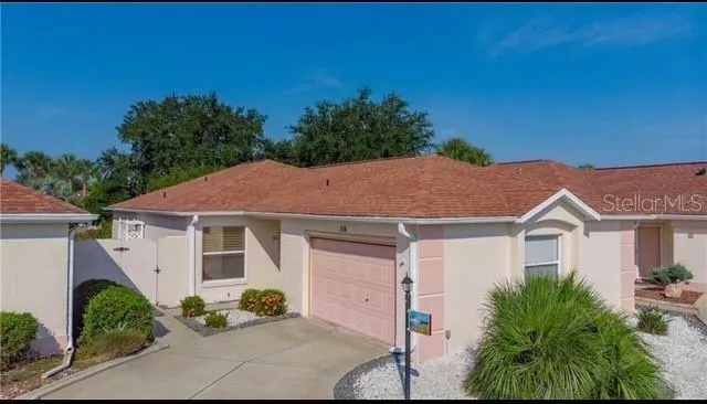a aerial view of a house with a yard