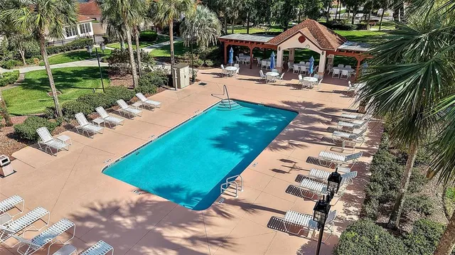 a view of a house with pool porch and chairs