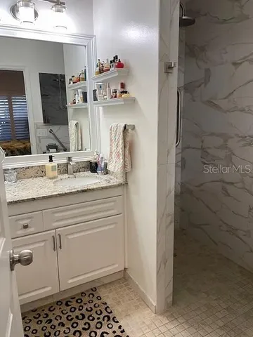 a bathroom with a sink and a mirror