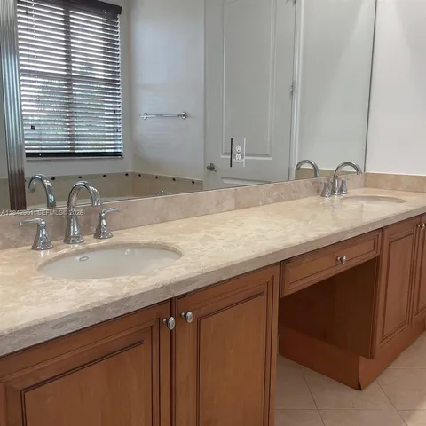 a view of staircase and living room with wooden floor