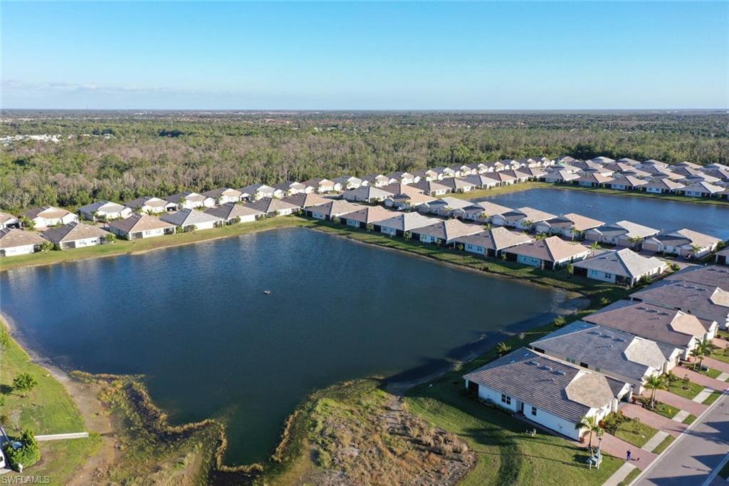 1066 Enbrook Loop Naples, FL 34114 - Photo 14 of 14 an aerial view of a city with ocean view