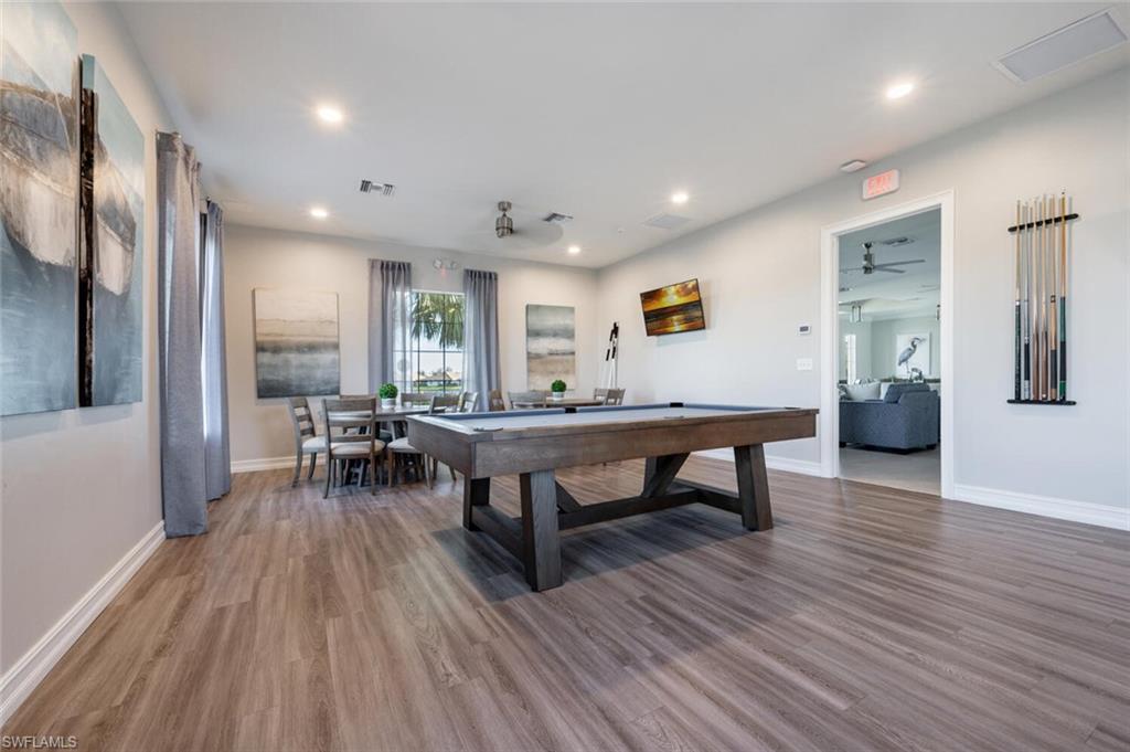 1066 Enbrook Loop Naples, FL 34114 - Photo 6 of 14 a living room with furniture and a wooden floor